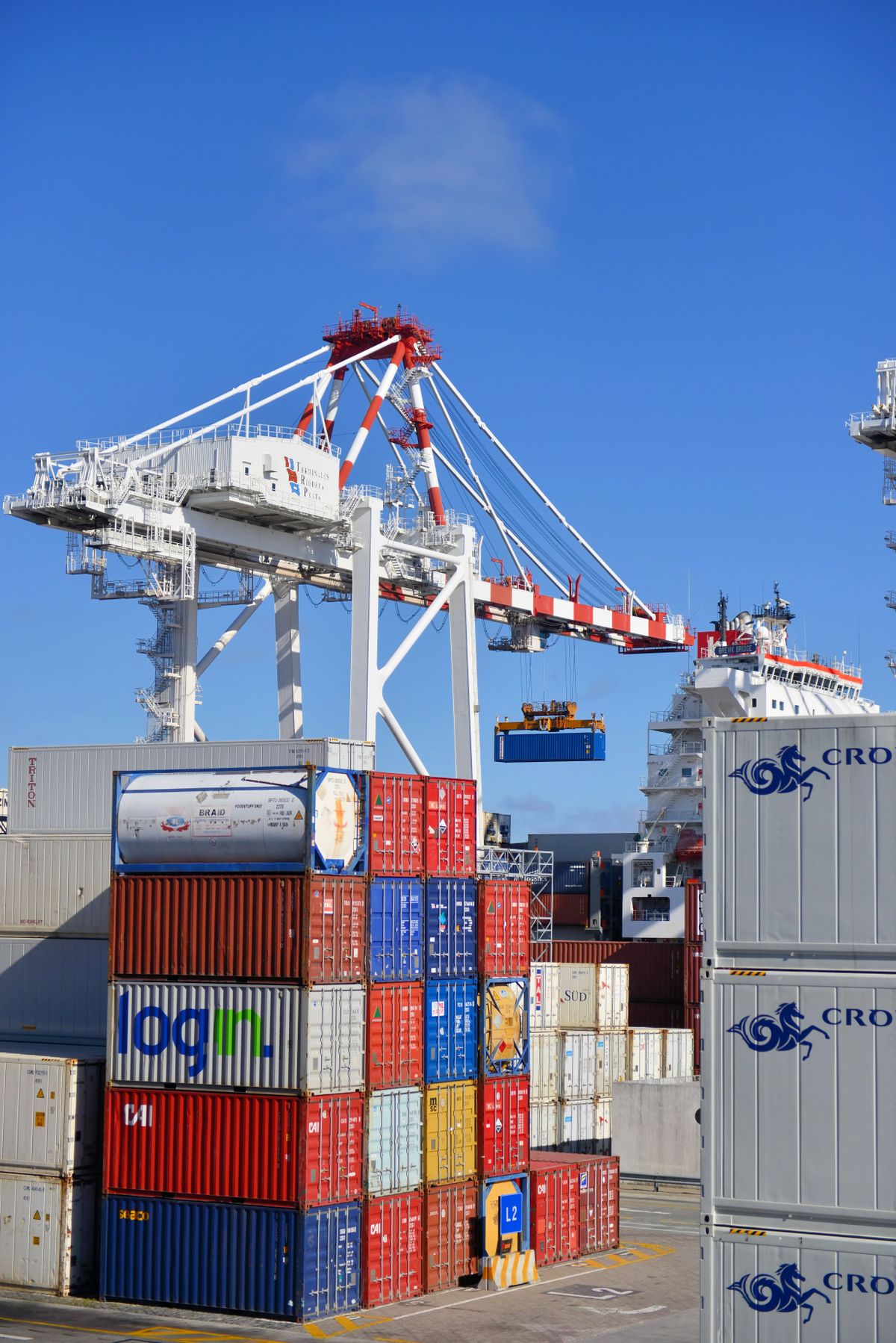 Shipping containers and cranes in an international freight terminal